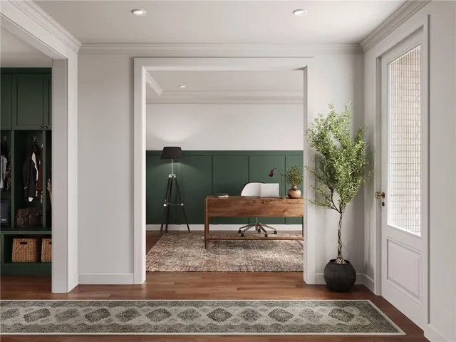 a living room with furniture and a potted plant