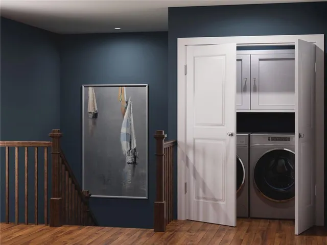 a view of a hallway with washer and dryer