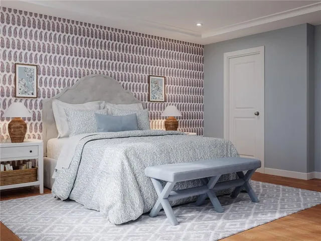 a bedroom with a table and chairs