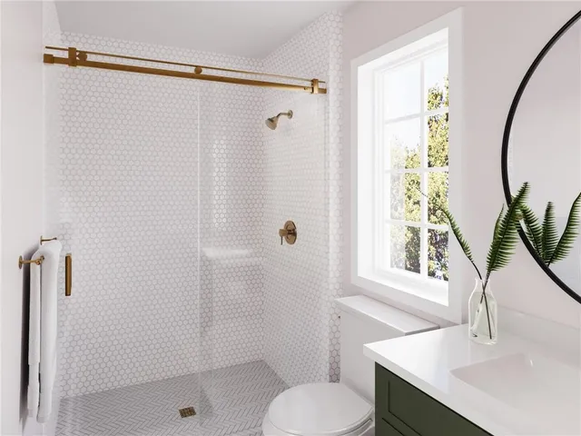 a bathroom with a sink toilet and shower