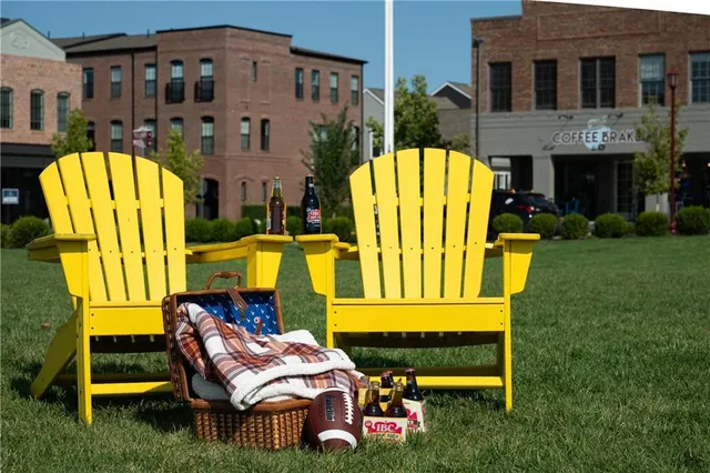 a view of a house with a yard and a garden