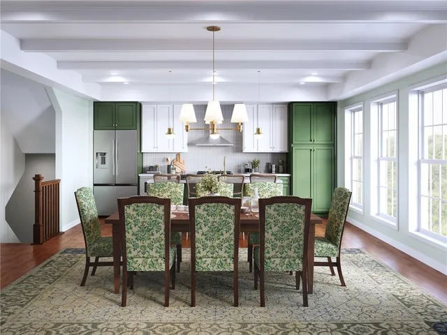 a dining room with furniture a rug and wooden floor