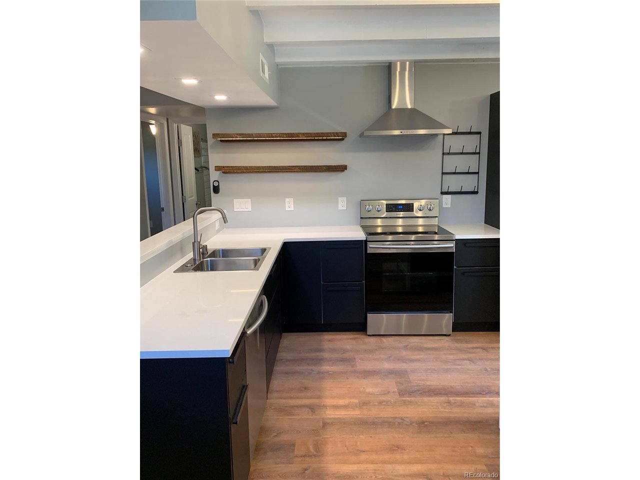 a kitchen with stainless steel appliances granite countertop a sink and cabinets