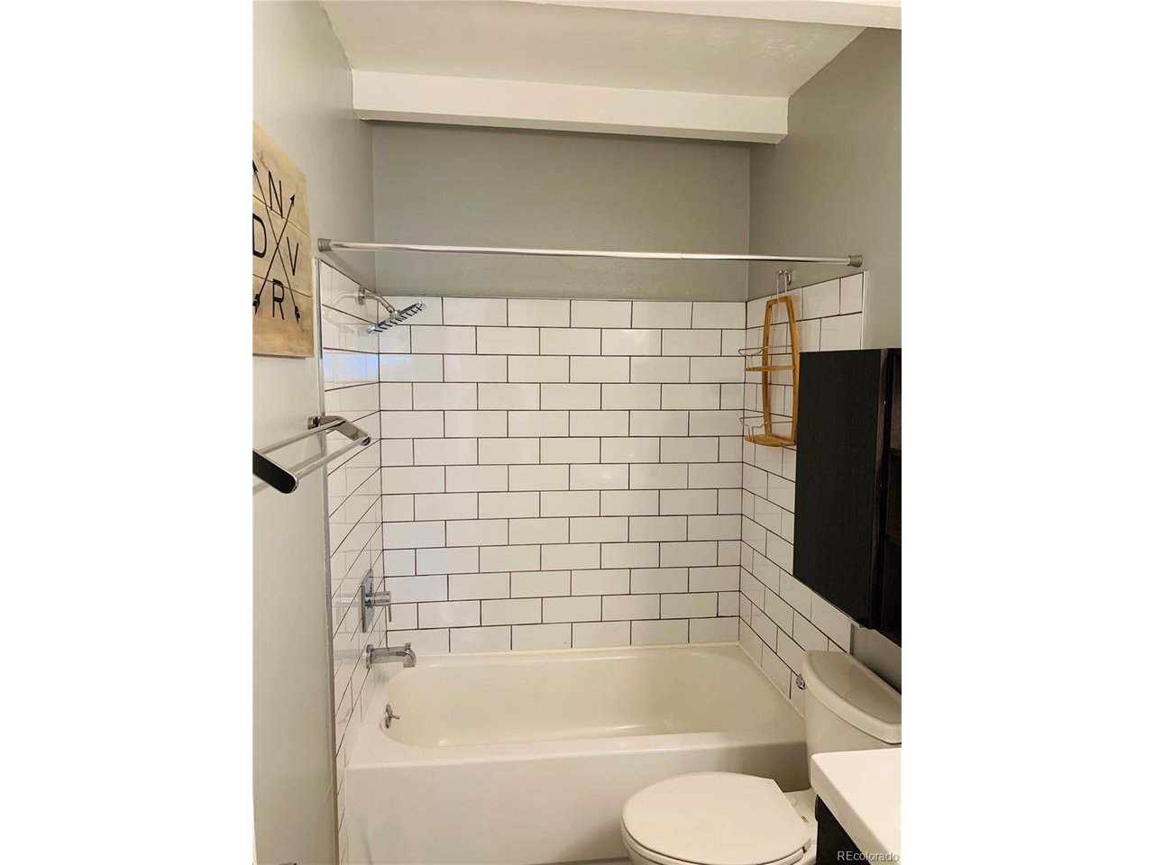 1040 Stuart Street Denver, CO 80204 - Photo 11 of 30 a bathroom with a bathtub and shower