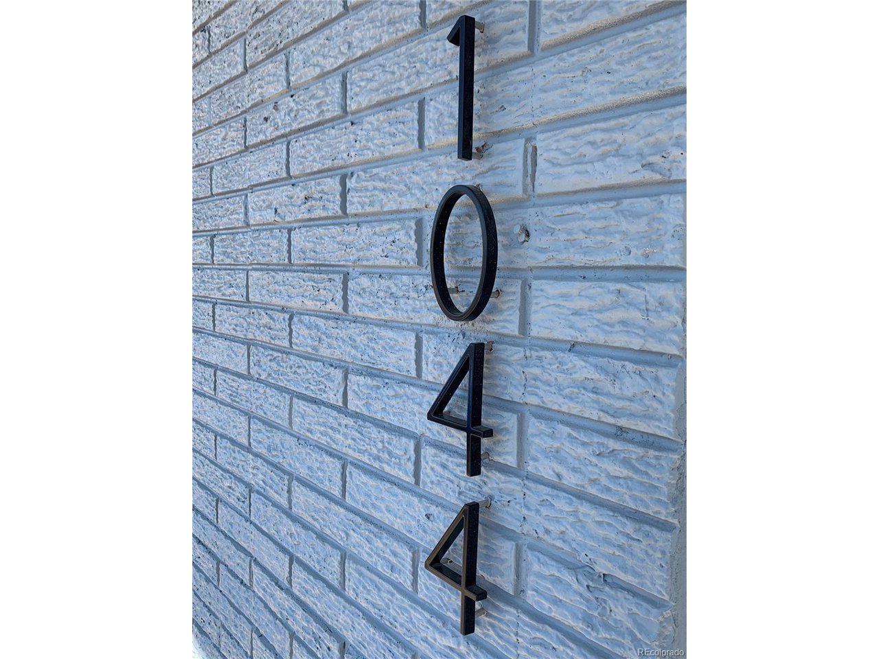 1040 Stuart Street Denver, CO 80204 - Photo 16 of 30 a bathroom with a sink and a mirror