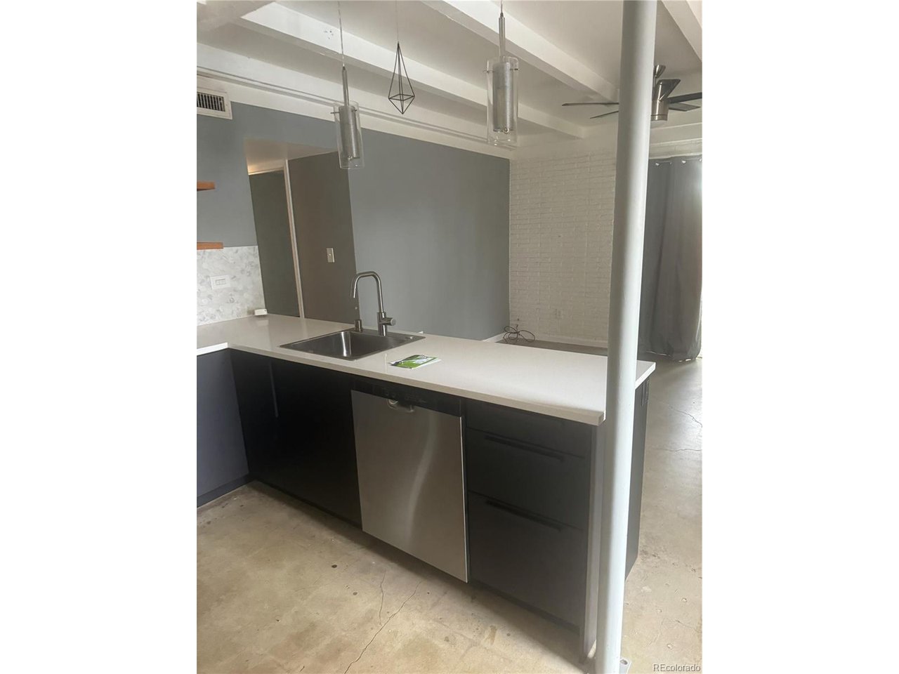 1040 Stuart Street Denver, CO 80204 - Photo 23 of 30 a utility room with a sink and a mirror