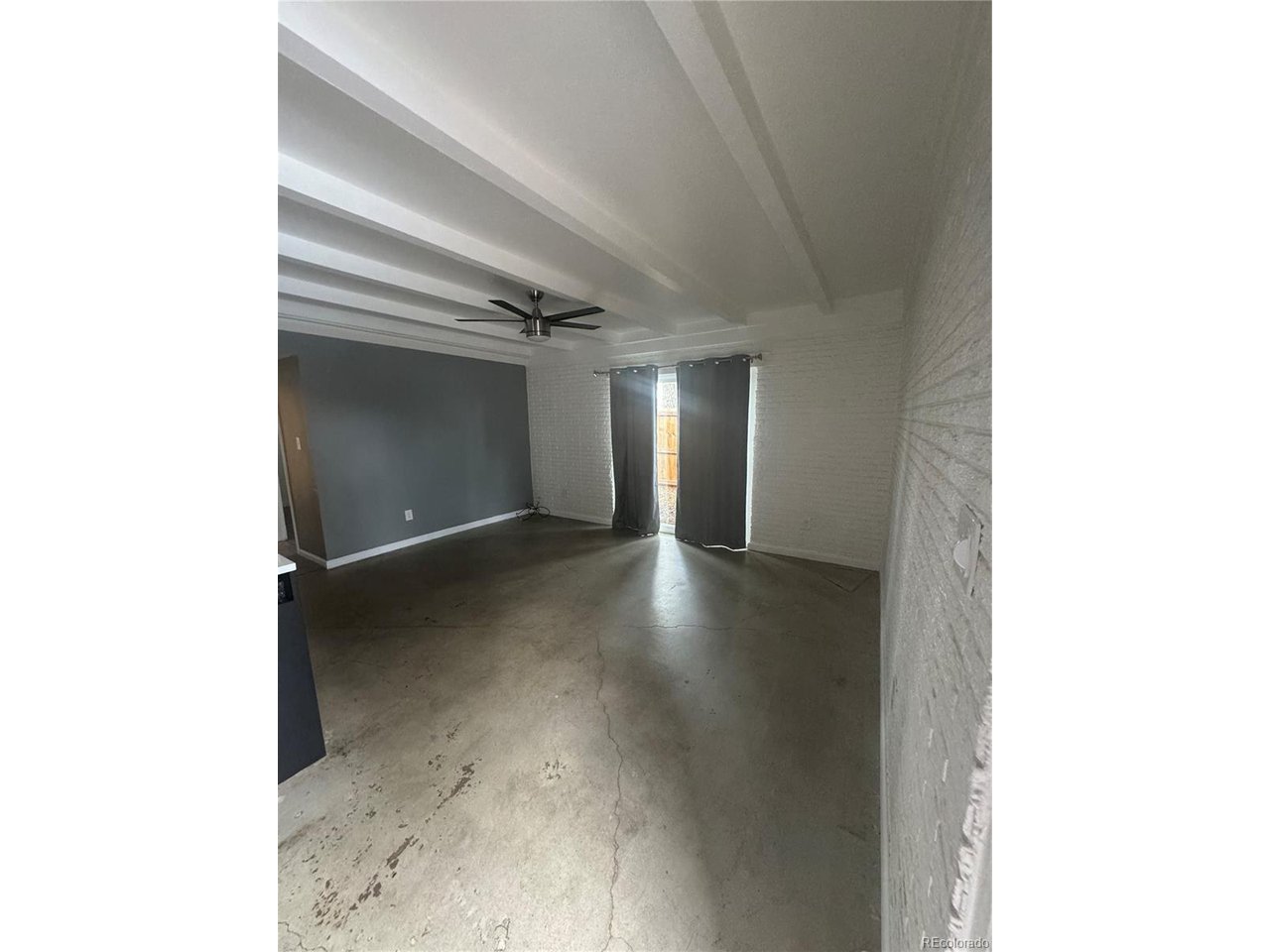 1040 Stuart Street Denver, CO 80204 - Photo 24 of 30 a view of a hallway with wooden floor