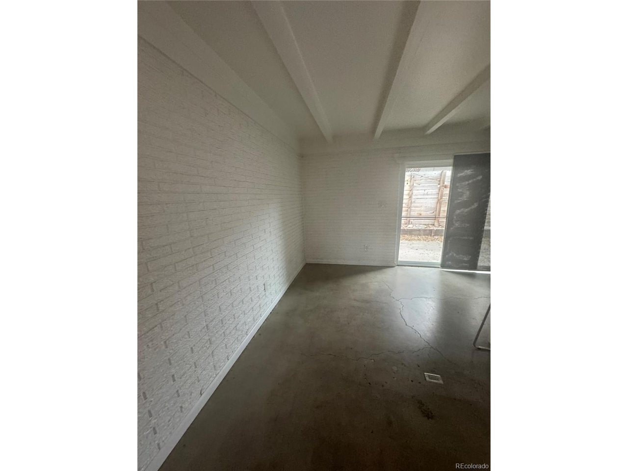 1040 Stuart Street Denver, CO 80204 - Photo 25 of 30 a view of an empty room with a window