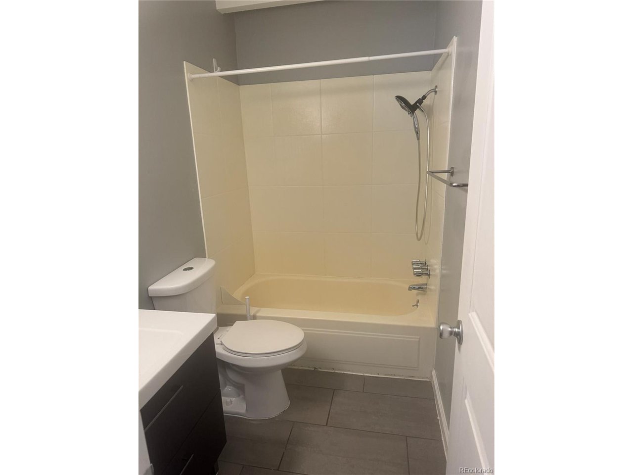 1040 Stuart Street Denver, CO 80204 - Photo 26 of 30 a bathroom with a shower and a toilet