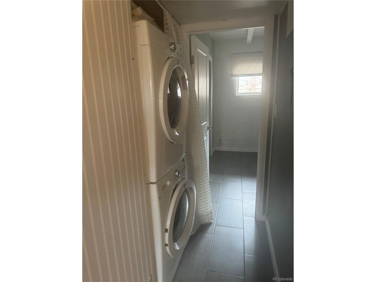 1040 Stuart Street Denver, CO 80204 - Photo 28 of 30 a view of a hallway with washer and dryer