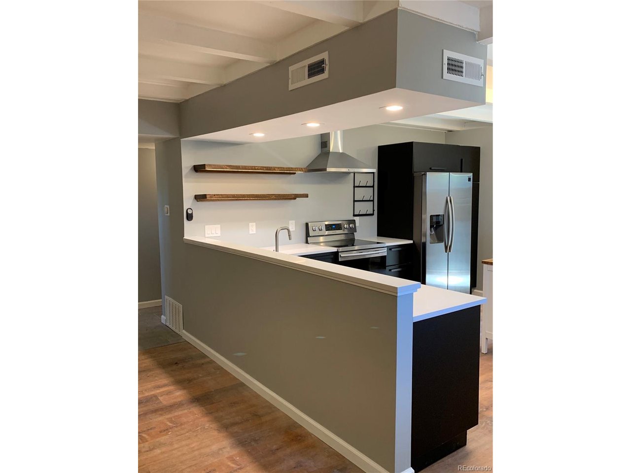 1040 Stuart Street Denver, CO 80204 - Photo 3 of 30 a kitchen with a sink and cabinets