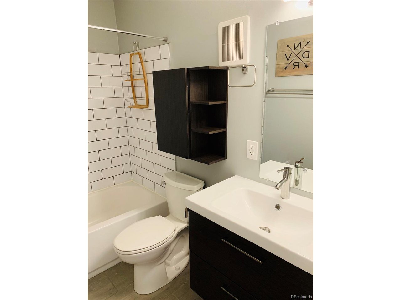1040 Stuart Street Denver, CO 80204 - Photo 10 of 30 a bathroom with a sink toilet and shower