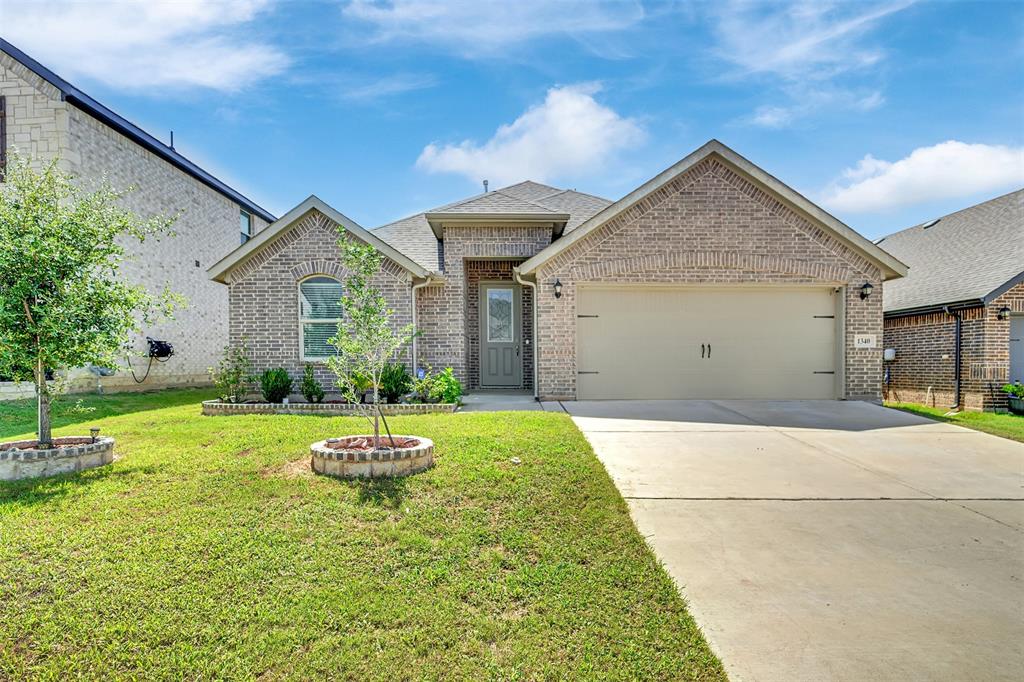 1340 Collett Sublett Road Kennedale, TX 76060 - Photo 1 of 25 Single-story residence featuring a brick facade with a two-car garage and concrete driveway