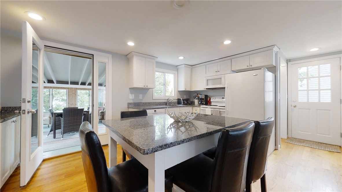 87 Treasure Road Narragansett, RI 02882 - Photo 5 of 21 The kitchen opens to a spacious sun porch and then further to the deck