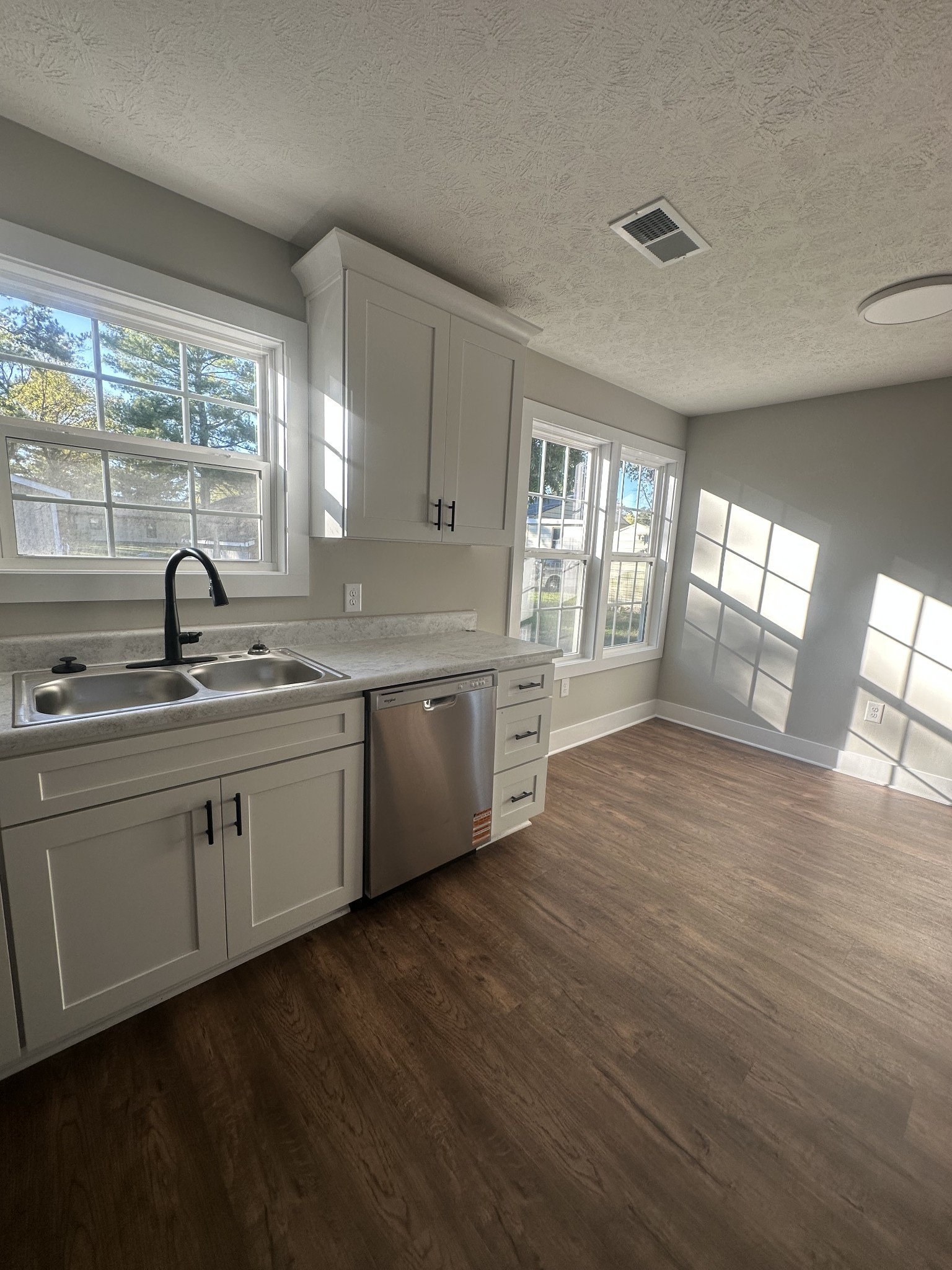 509 Brakefield Street Cowan, TN 37318 - Photo 11 of 19 a kitchen with a sink cabinets and wooden floor