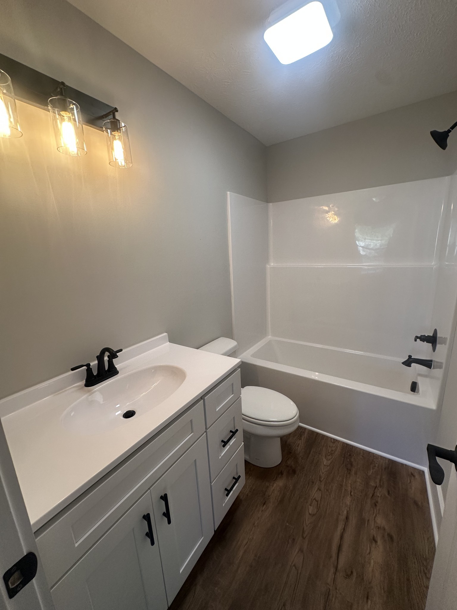 509 Brakefield Street Cowan, TN 37318 - Photo 13 of 19 a bathroom with a sink a toilet and shower