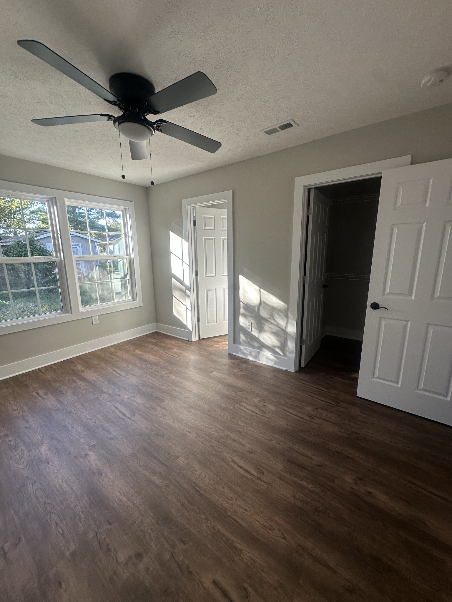 509 Brakefield Street Cowan, TN 37318 - Photo 15 of 19 a view of an empty room with wooden floor and a window