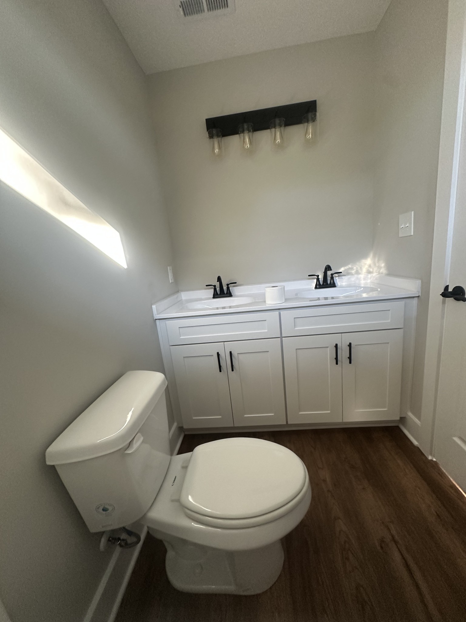 509 Brakefield Street Cowan, TN 37318 - Photo 16 of 19 a bathroom with a sink a toilet and mirror