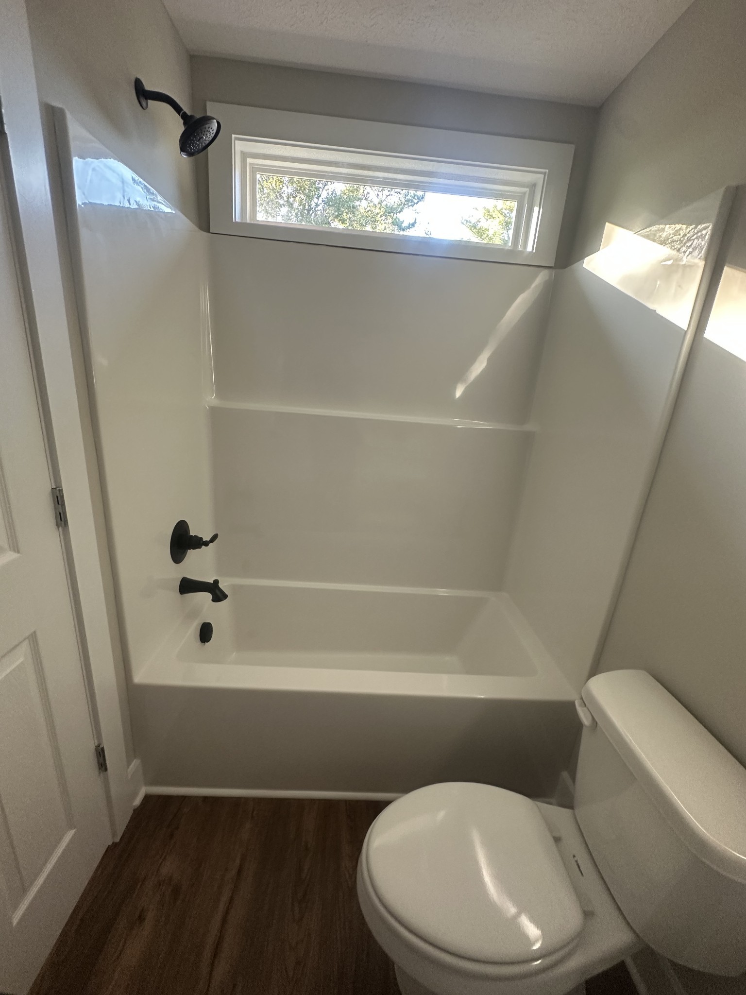 509 Brakefield Street Cowan, TN 37318 - Photo 17 of 19 a bathroom with a toilet and a shower