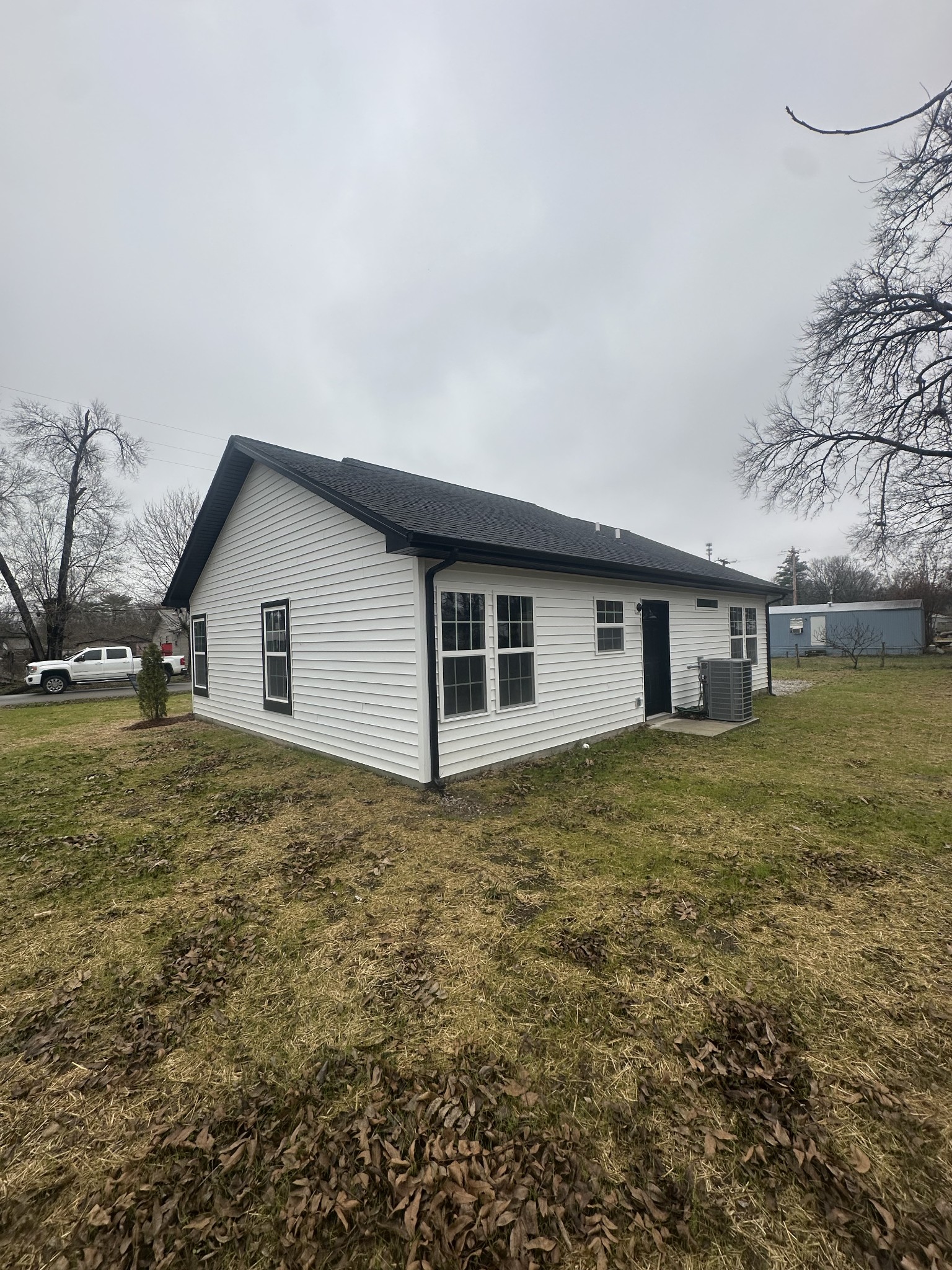 509 Brakefield Street Cowan, TN 37318 - Photo 3 of 19 a view of a house with a yard