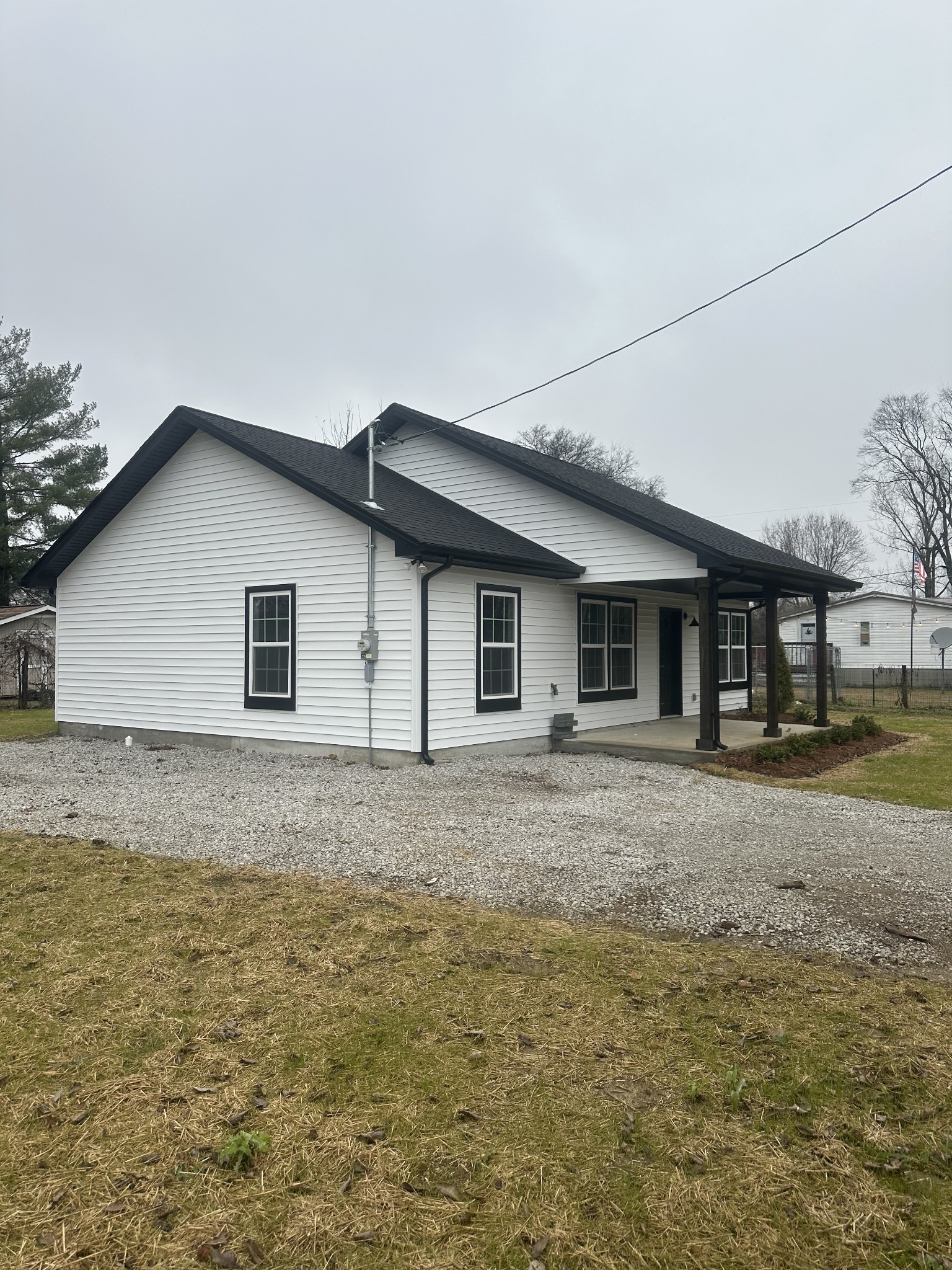 509 Brakefield Street Cowan, TN 37318 - Photo 5 of 19 a view of a yard in front of a house with large tree