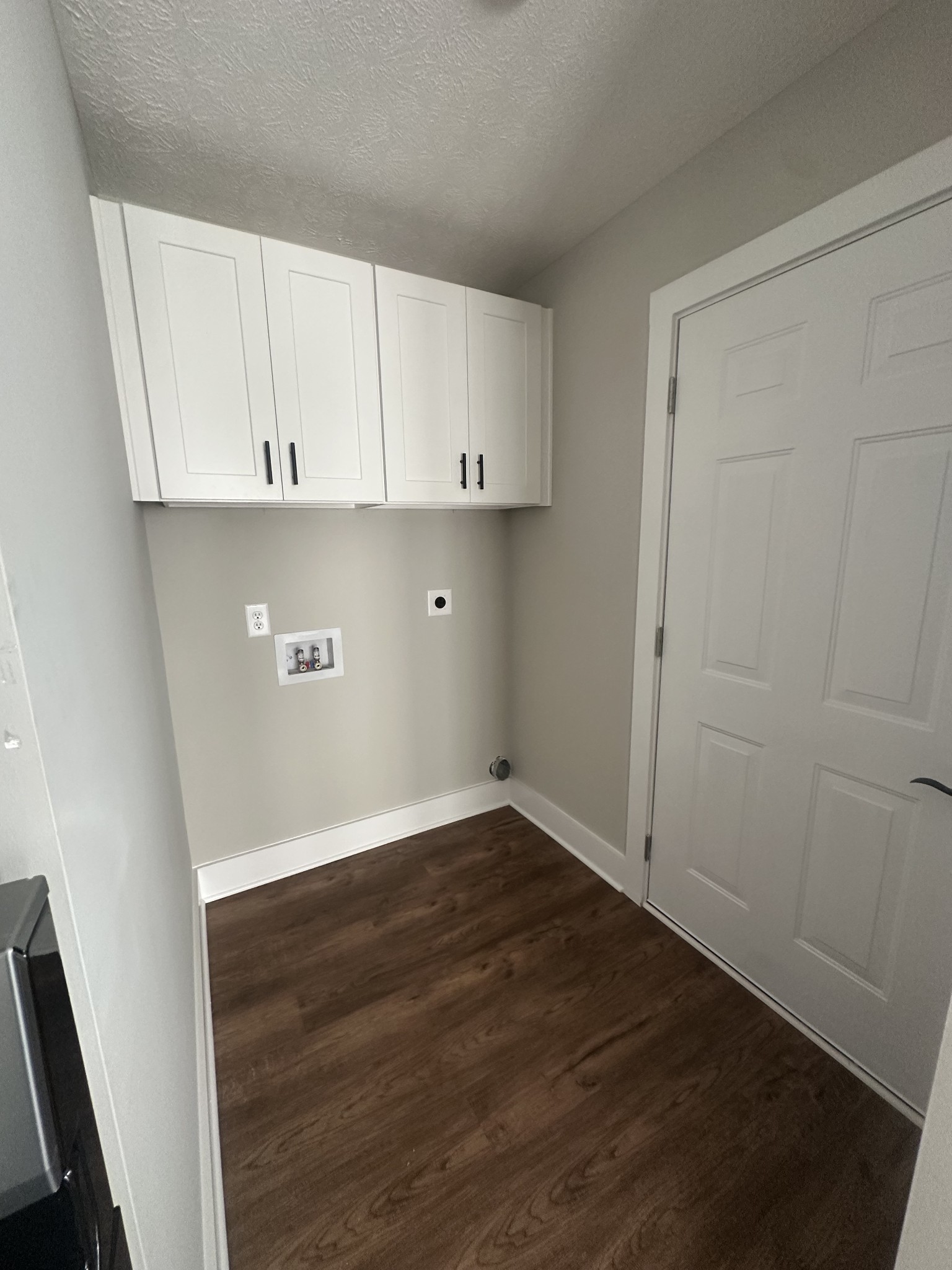 509 Brakefield Street Cowan, TN 37318 - Photo 9 of 19 an empty room with wooden floor and cabinet
