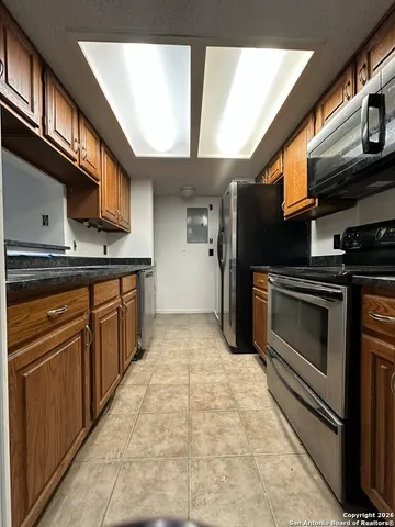 a view of outdoor space with signage and flags