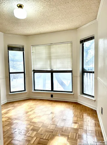 a view of a chairs and table in the patio