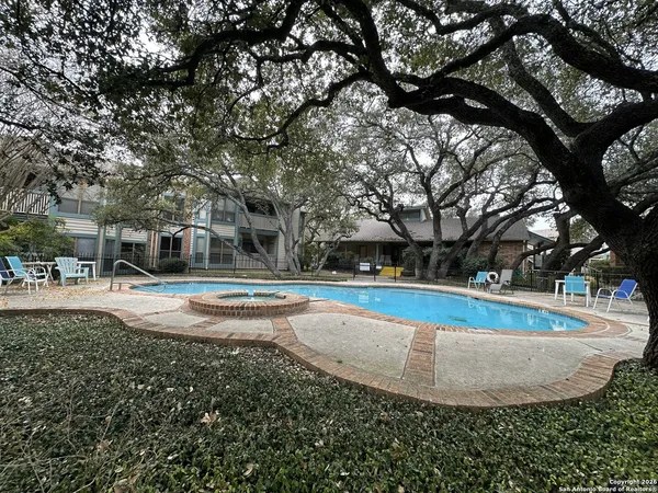 a view of a chairs and table in the patio