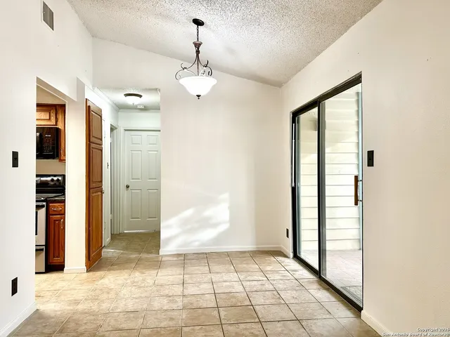 a view of kitchen with furniture and a fireplace
