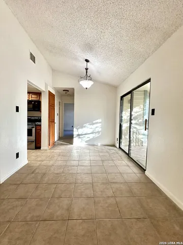 a kitchen with stainless steel appliances granite countertop a stove and a sink