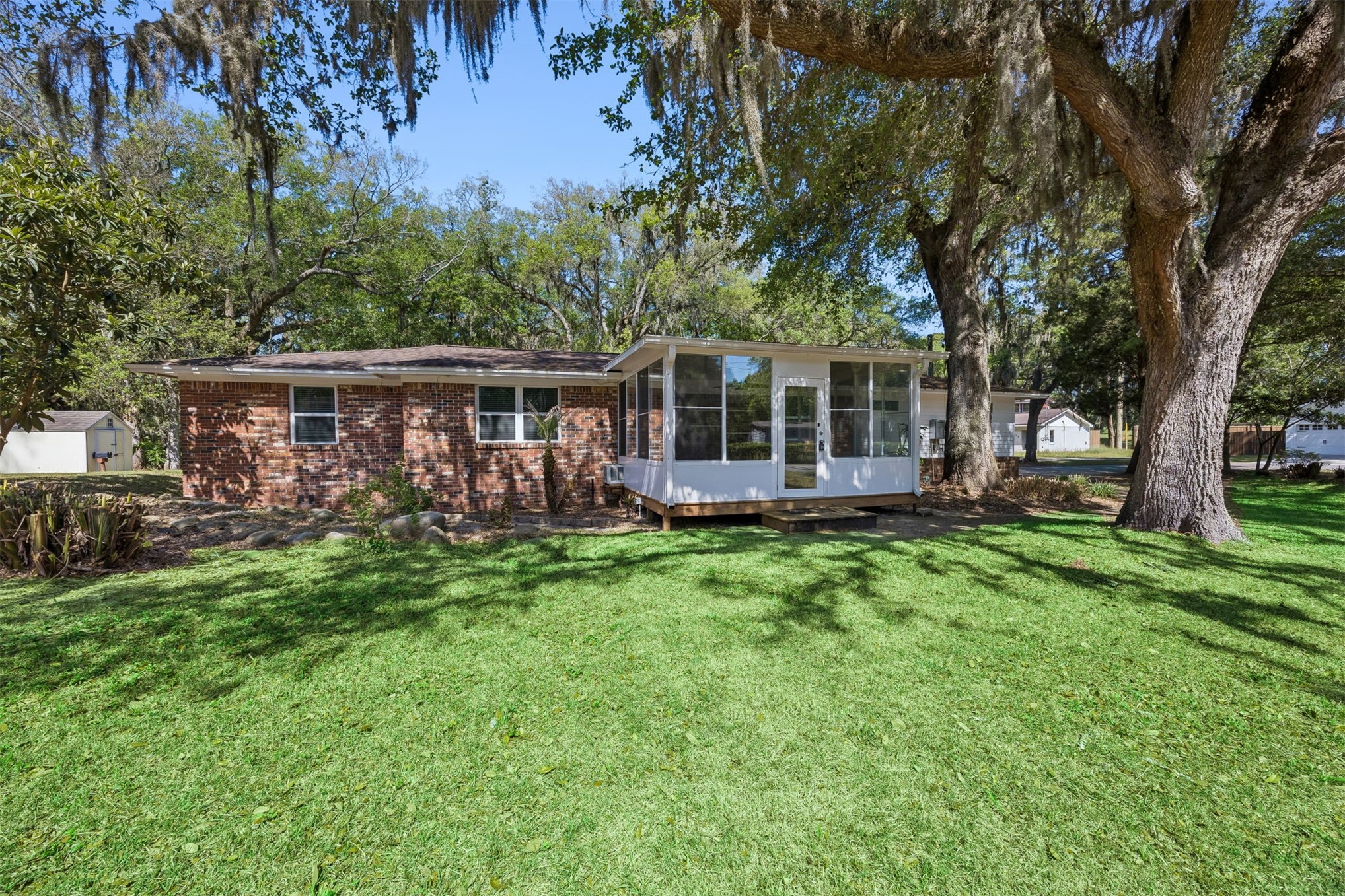 Ranch style home with enclosed porch on a corner lot
