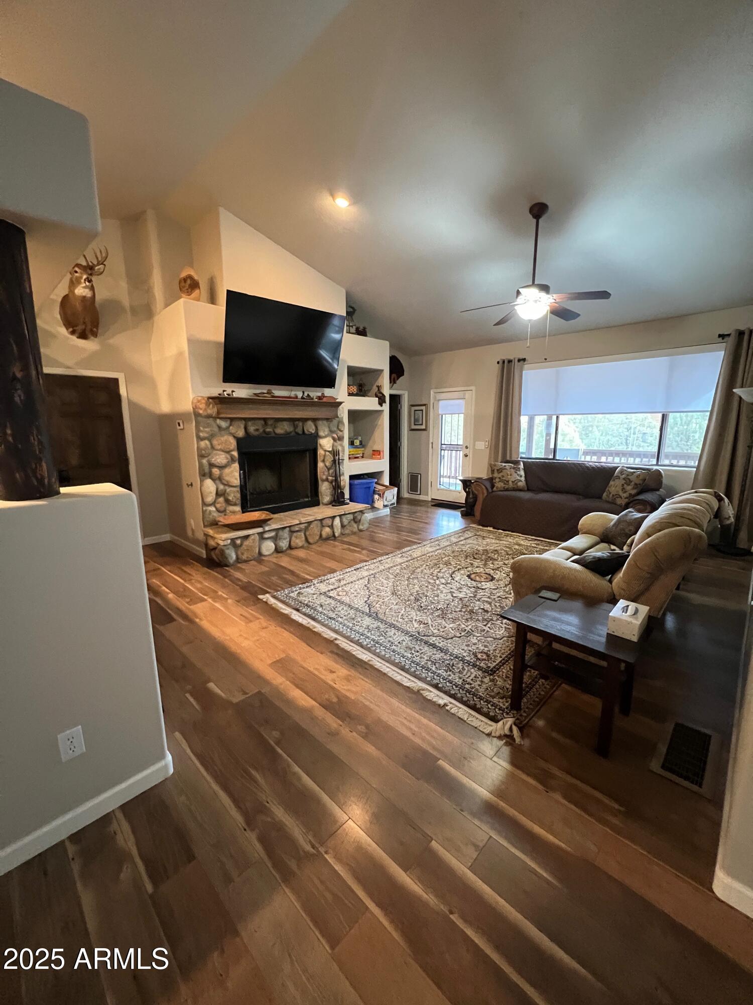 3473 High Country Drive Heber, AZ 85928 - Photo 15 of 38 a living room with furniture and a flat screen tv