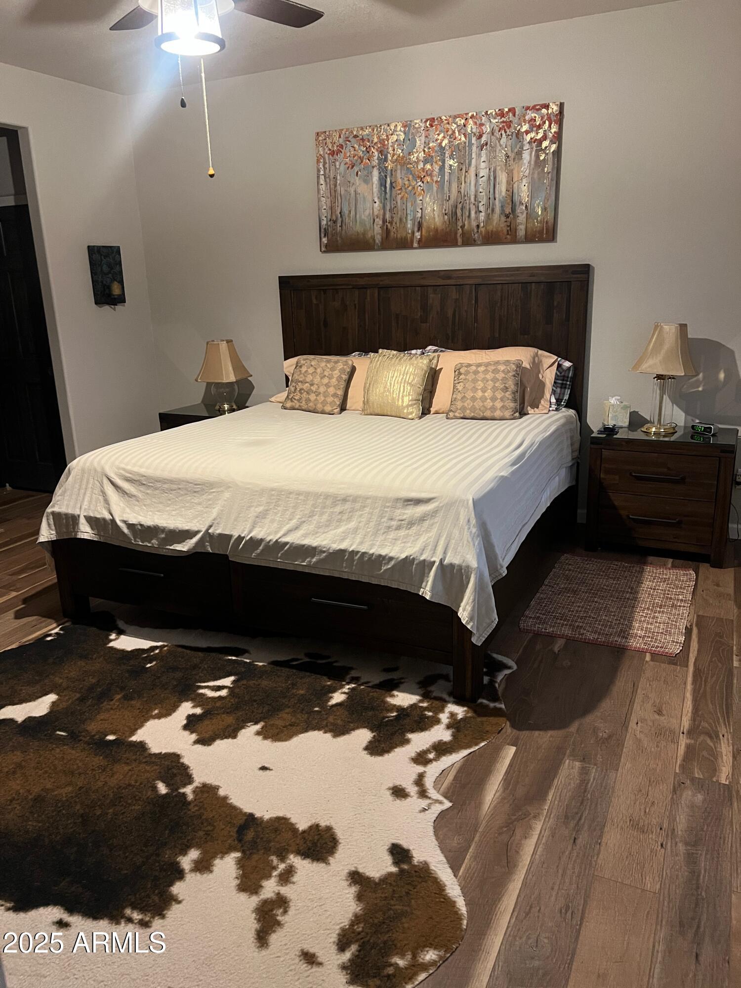 3473 High Country Drive Heber, AZ 85928 - Photo 16 of 38 a bed sitting in a bedroom next to a lamp