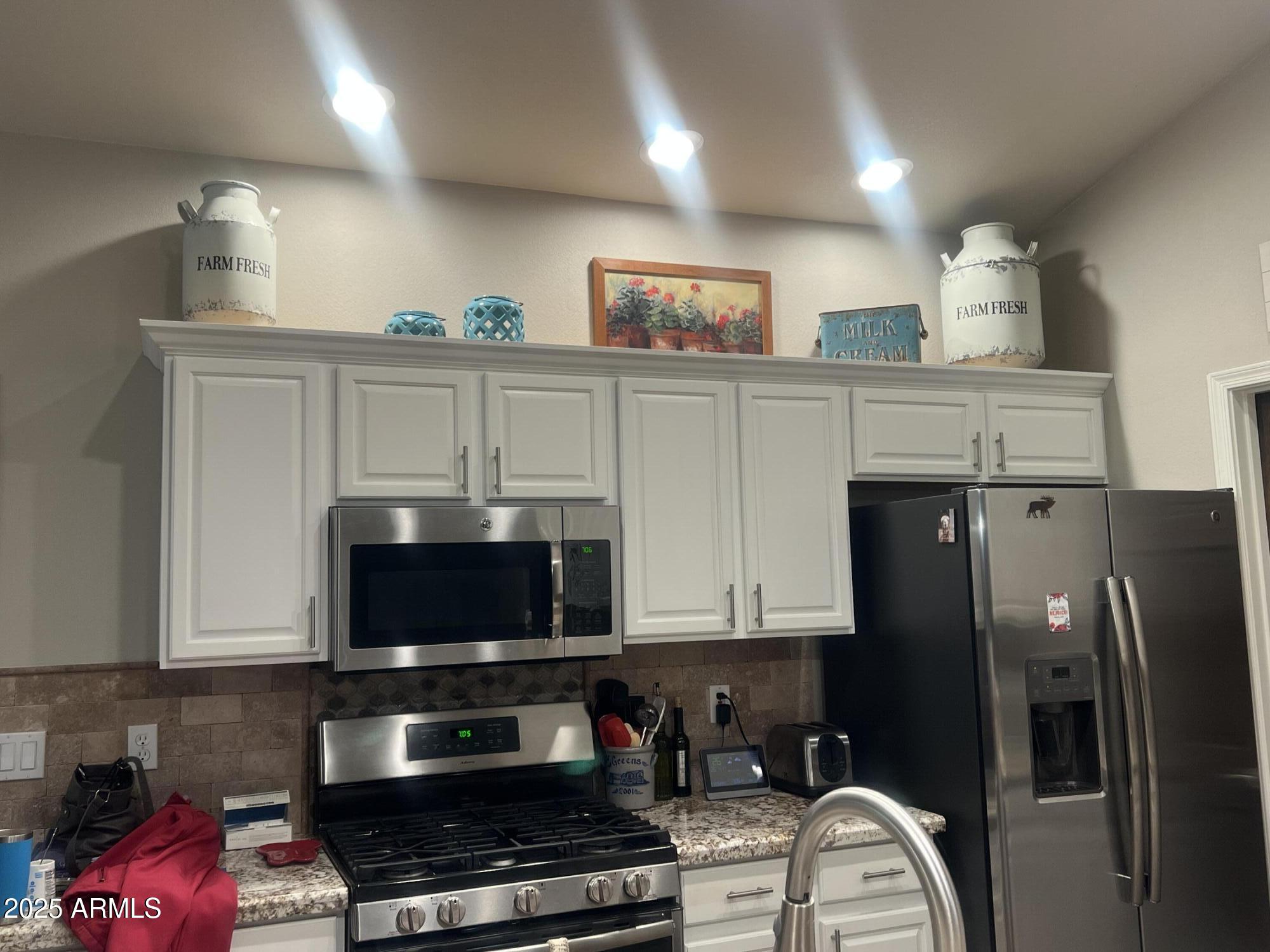 3473 High Country Drive Heber, AZ 85928 - Photo 5 of 38 a kitchen with stainless steel appliances granite countertop a refrigerator a stove and a sink