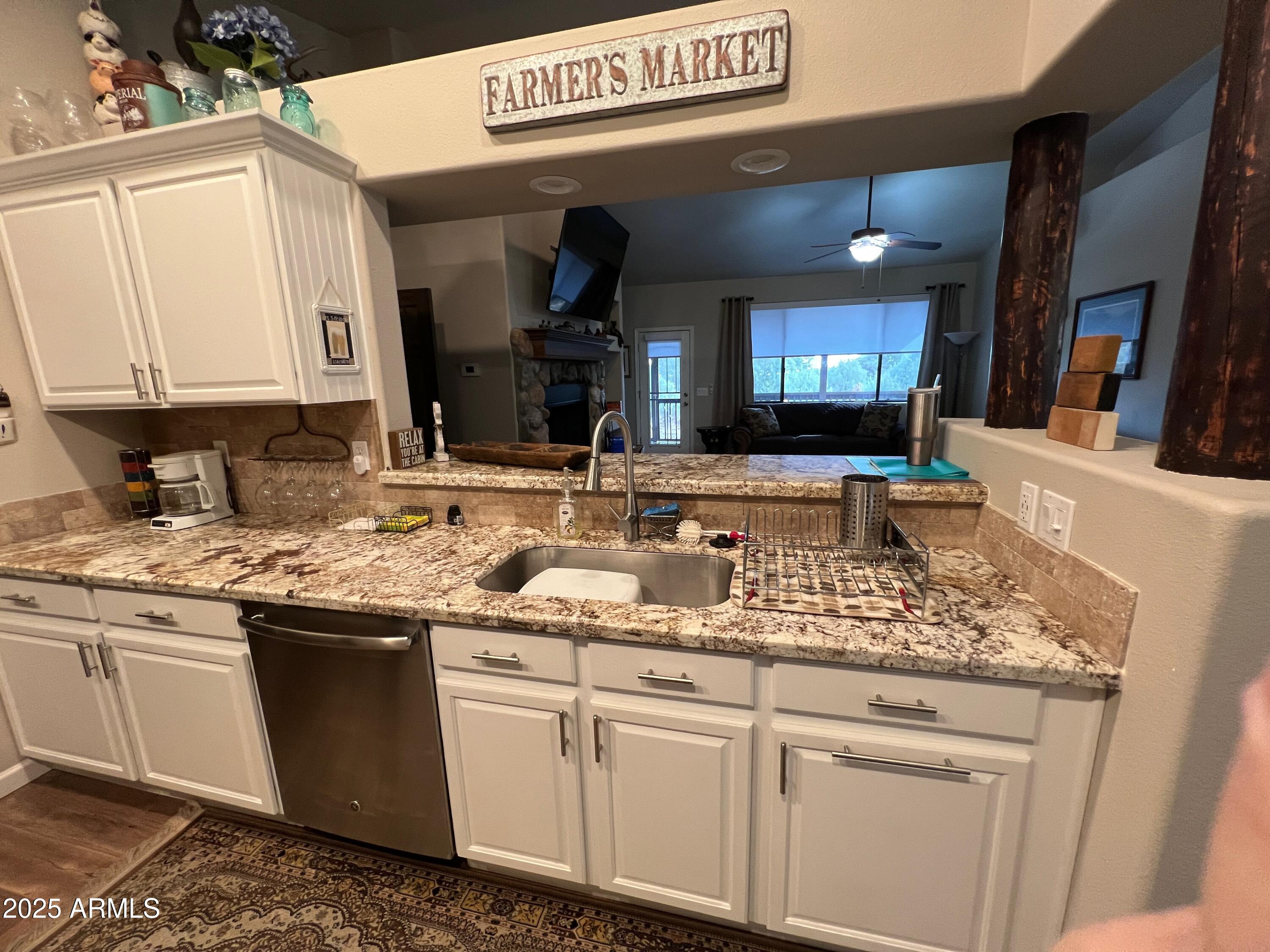 3473 High Country Drive Heber, AZ 85928 - Photo 6 of 38 a kitchen with stainless steel appliances granite countertop a sink and cabinets