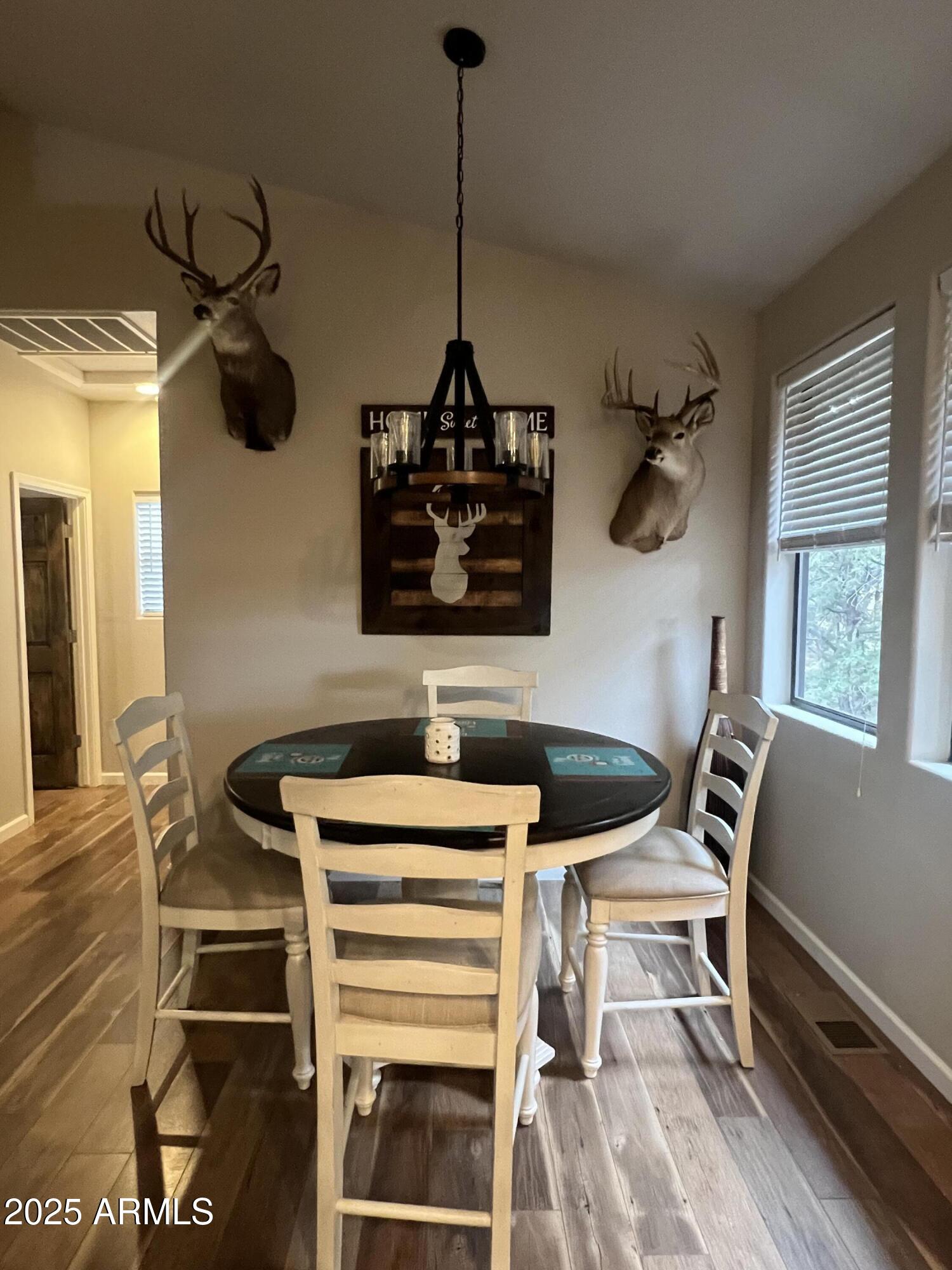 3473 High Country Drive Heber, AZ 85928 - Photo 9 of 38 a table room with a desk and a stove