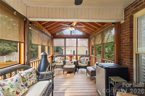 a view of living room with furniture and floor to ceiling window