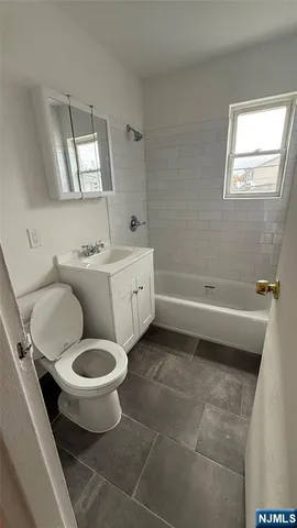 a view of a car parked in front of a building