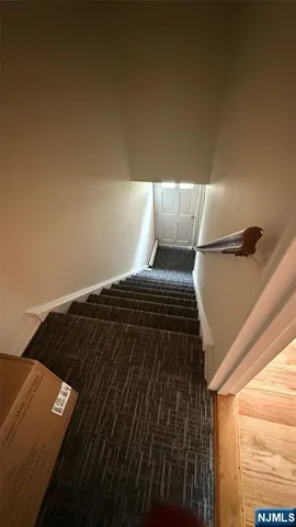 a kitchen with granite countertop a stove and a microwave