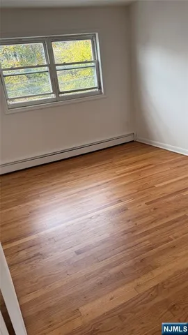 a view of room and wooden floor