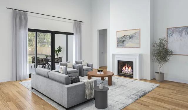 a bedroom with a large bed and windows