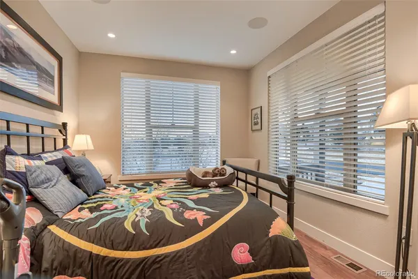 a bed room with a bed and a chandelier