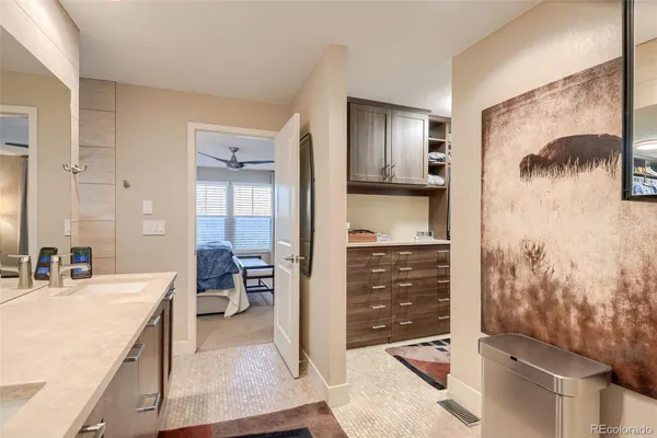 a living room with furniture and a dining table with wooden floor