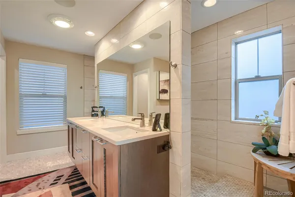 a bedroom with a bed and a couch