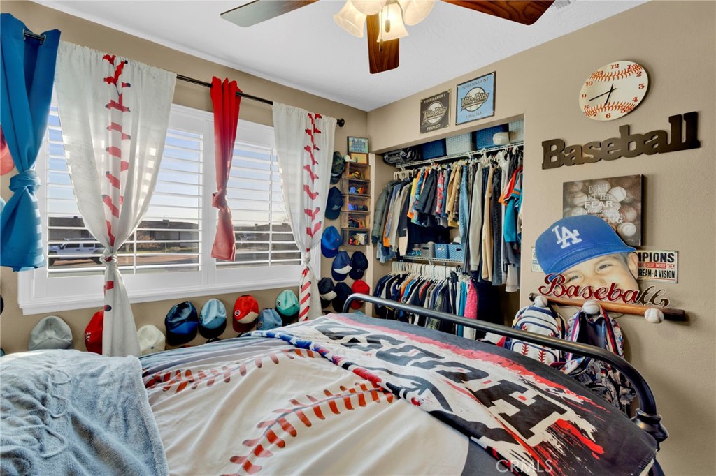 21940 Carlisle Road Apple Valley, CA 92307 - Photo 17 of 32 a bedroom with a bed and a window