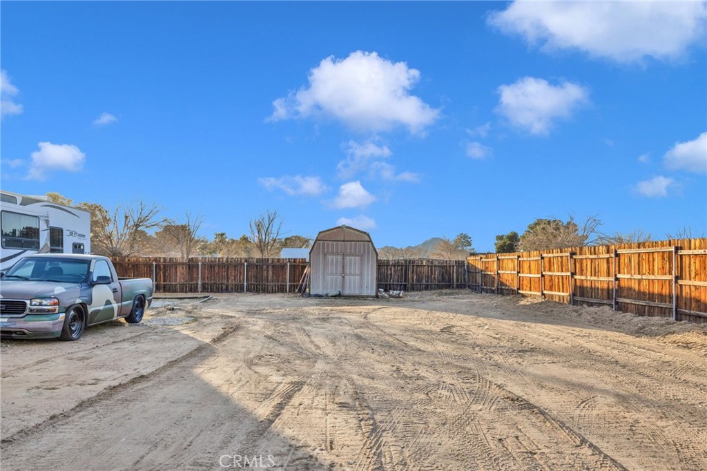 21940 Carlisle Road Apple Valley, CA 92307 - Photo 31 of 32 a view of a houses with a big yard