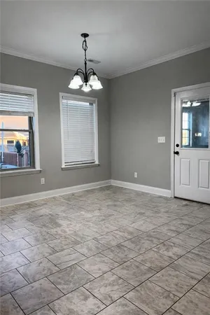 a view of an empty room with a window