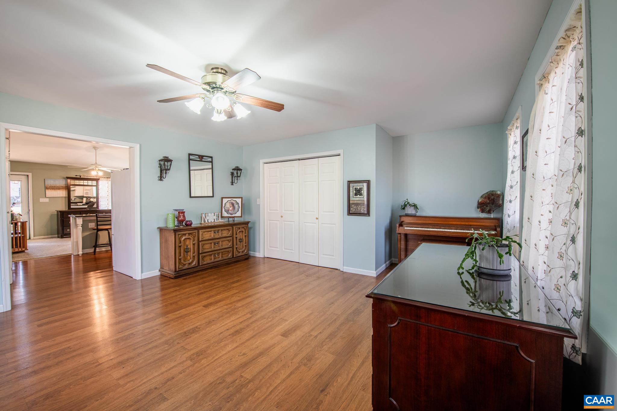 18 Cliftwood Road Palmyra, VA 22963 - Photo 13 of 28 a view of a livingroom with wooden floor and ceiling fan