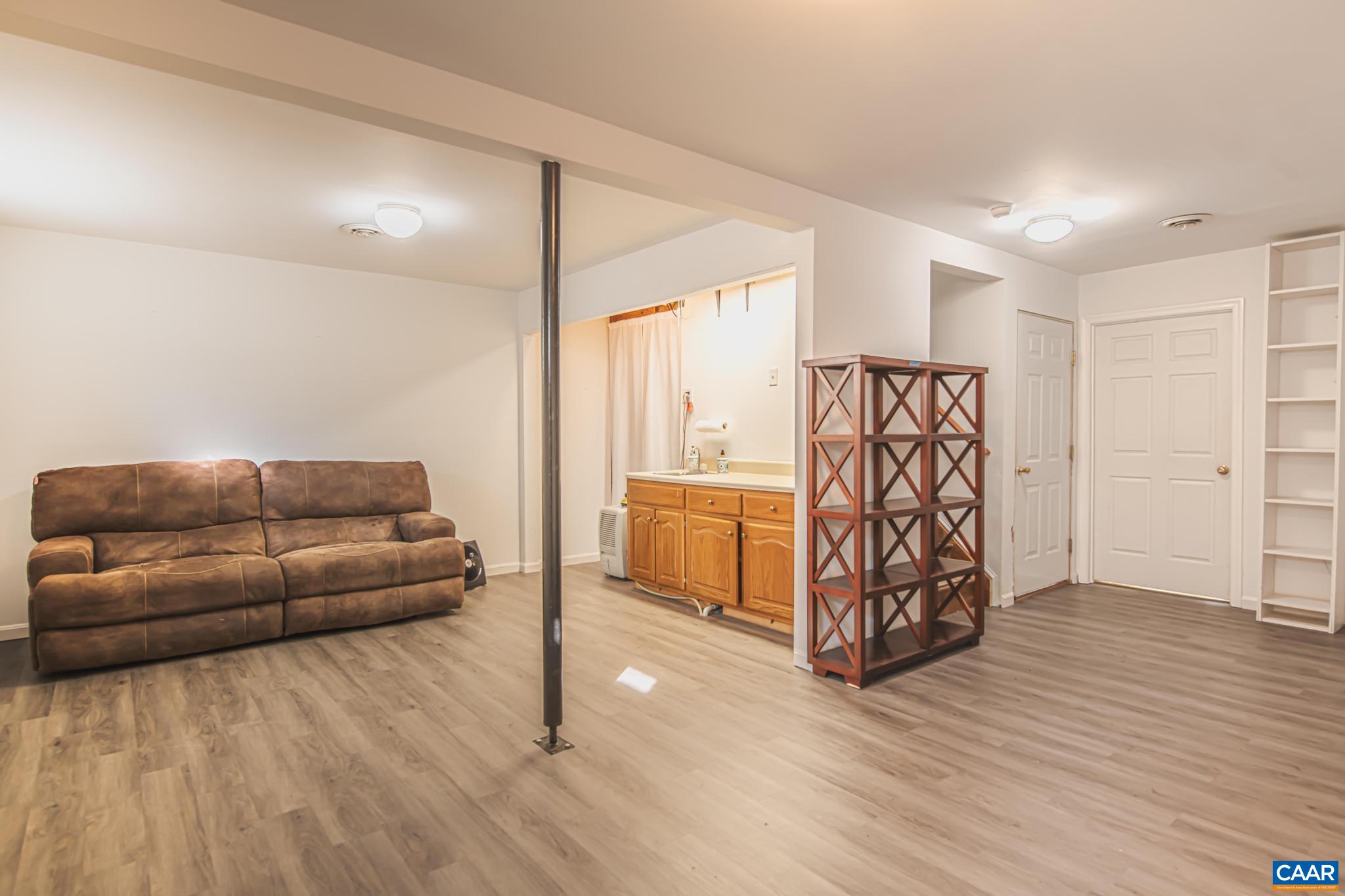 18 Cliftwood Road Palmyra, VA 22963 - Photo 22 of 28 a living room with furniture and a wooden floor